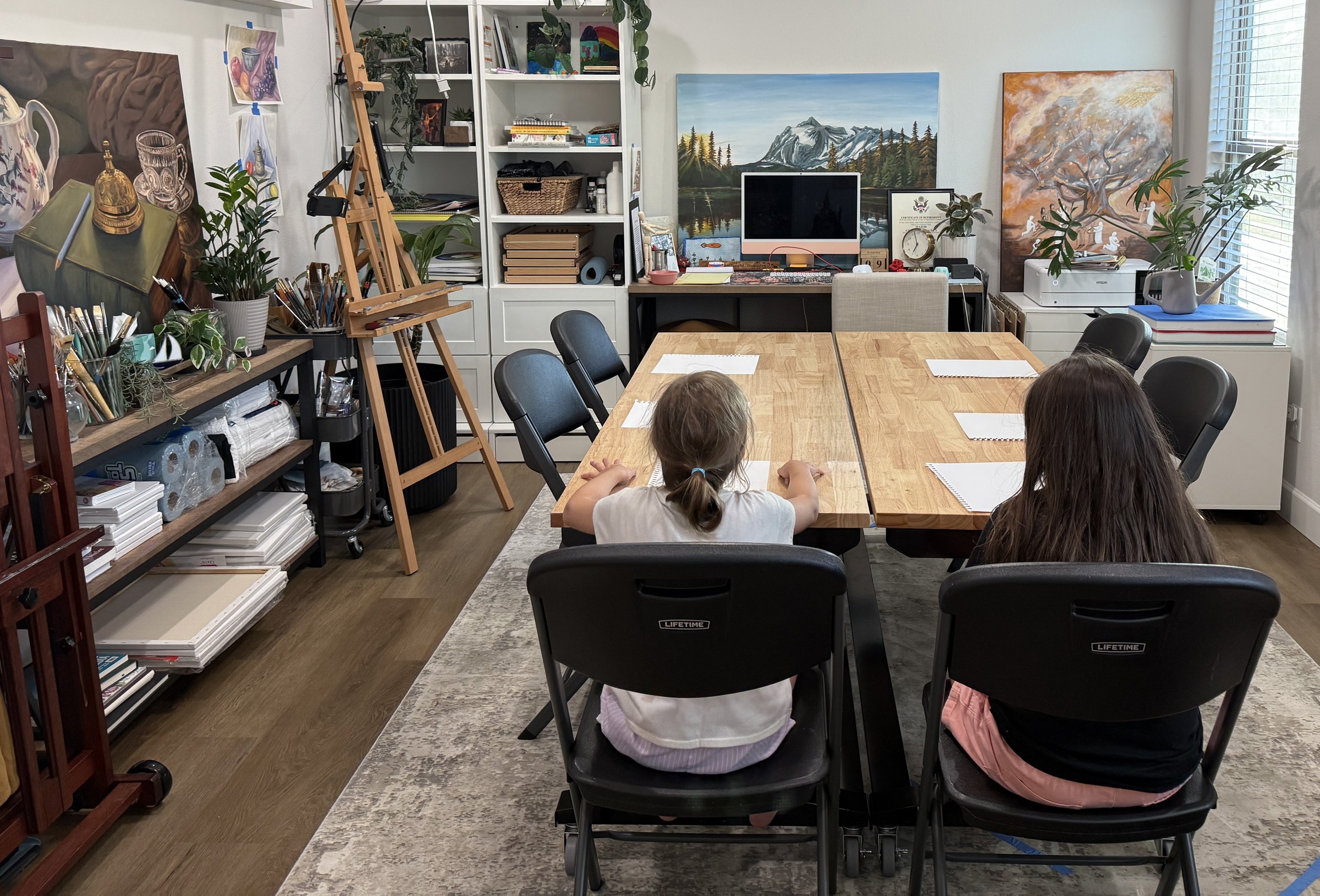 Students planning their design concepts at the studio table